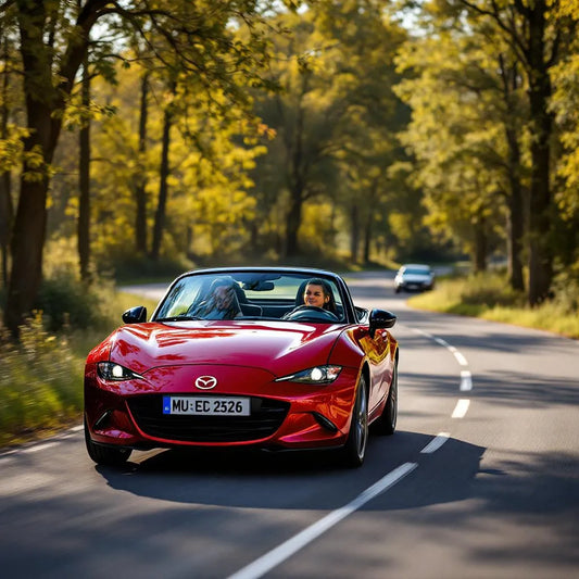 Mazda MX-5 NC Essence 1.8 126 rouge sur route de campagne
